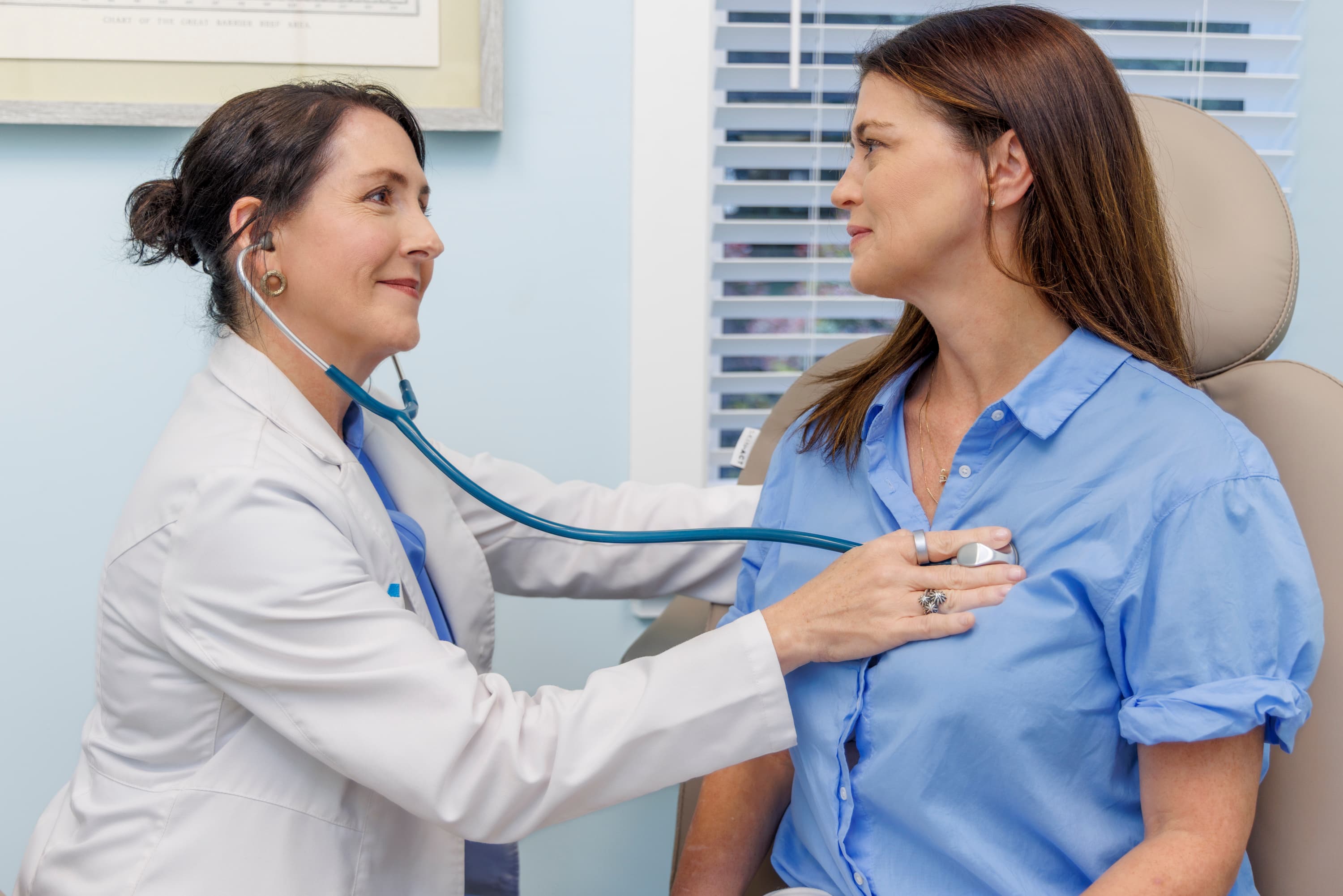 Dr. Shonna McGee speaking with a patient at Coastal Care Vitality